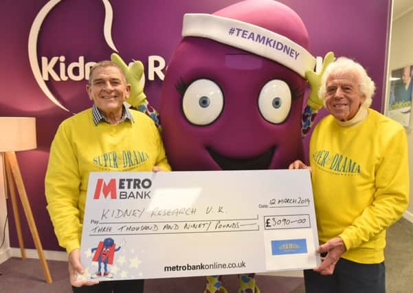 Andy Sanders and Bill Marriott from Super Drama presenting cheque for money raised at their latest production to Kidney Research UK EMN-190316-110812009