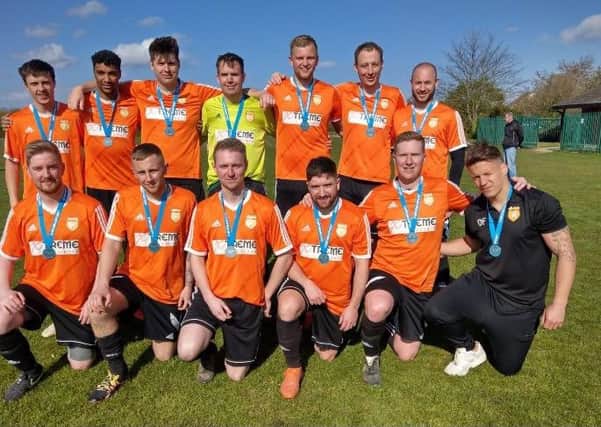 Thorney FC with their Peterborough Premier Division runners-up medals.