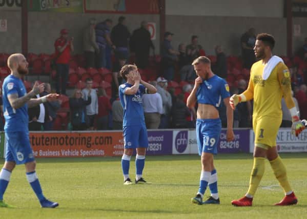 Posh players are dismayed after conceding a late equaliser at Fleetwood. Photo: Joe Dent/theposh.com.