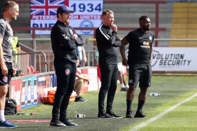Posh manager Darren Ferguson and Fleetwood boss Joey Barton watch the game. Photo: Joe Dent/theposh.com.