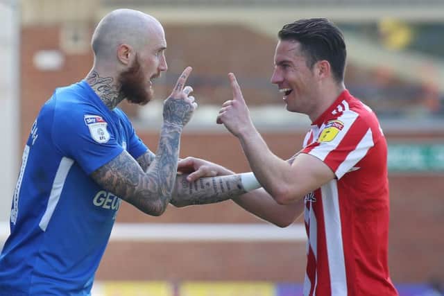 Posh star Marcus Maddison and Sunderland full-back Bryan Oviedo disagree after the former's caution for simulation. Photo: Joe Dent/theposh.com.