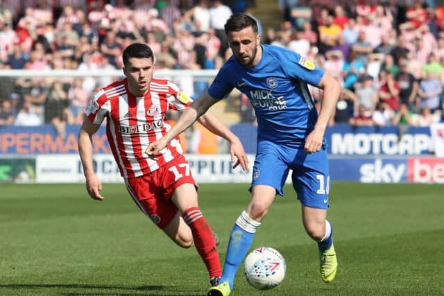 Daniel Lafferty of Peterborough United in action with Lewis Morgan of Sunderland. Photo: Joe Dent/theposh.com.