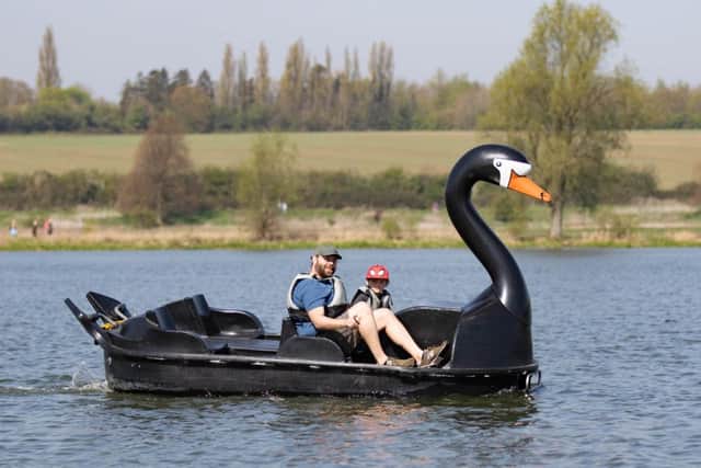 People enjoying the hot weather at Nene Park on Saturday. Photo: Terry Harris