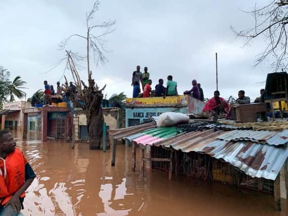 People sheltering on roofs in Mozambique