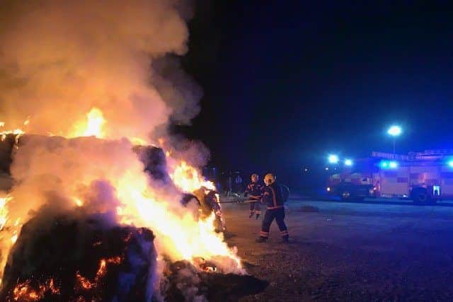 Firefighters tackle the bale hay fire in Werrington. Photo: Cambridgeshire Fire and Rescue Service