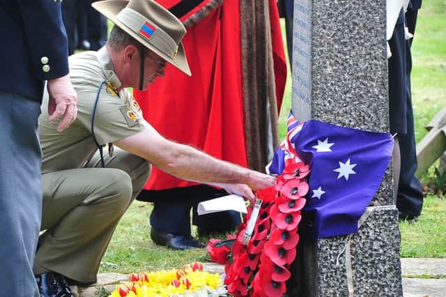 Service of Thanksgiving and Remembrance on ANZAC Day at the grave of Sgt Hunter at Broadway Cemetery attended by Standard bearers from The Royal British Legion Peterborough Branch. WO2 Nick England from RAEME unit- Melbourne laying a wreath ENGEMN00120130425154258