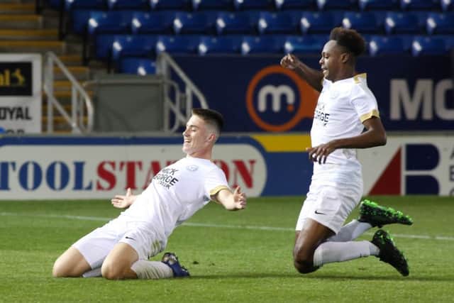 Flynn Clarke celebrates after making it 3-0 to Posh. Picture: Joe Dent