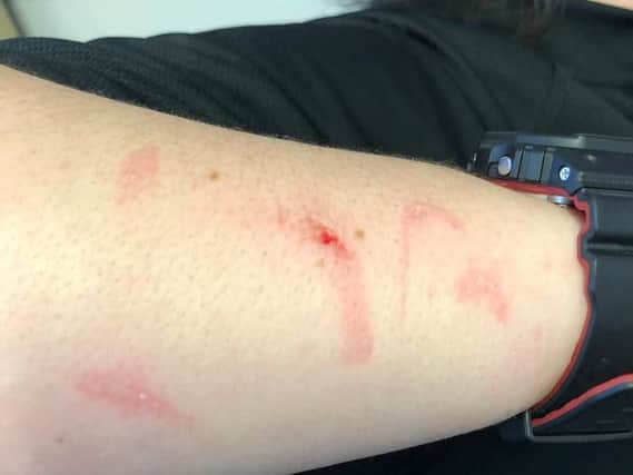 The marks on the arm of the transport police officer. Photo: British Transport Police