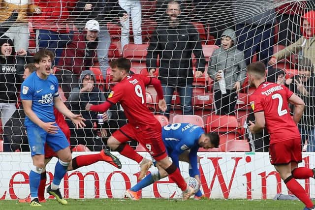 Posh skipper Alex Woodyard is angry as Walsall score their second goal. Photo: Joe Dent/theposh.com.
