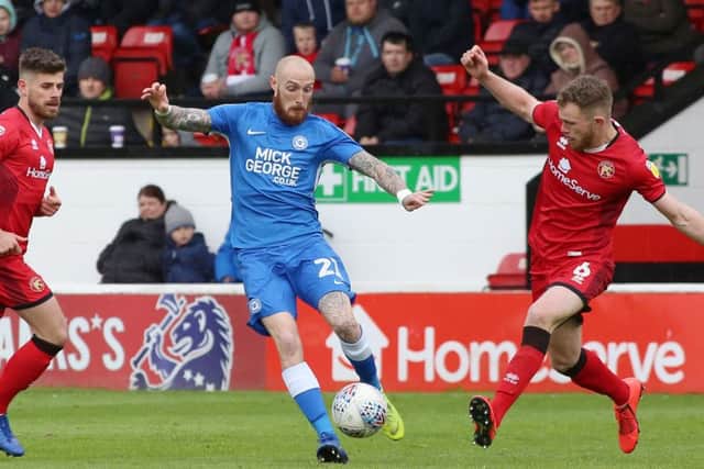 Marcus Maddison of Posh delivers a cross into the Walsall penalty area. Photo: Joe Dent/theposh.com.