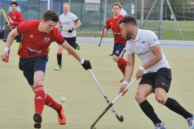 Action from City of Peterborough (red) v Bowden. Photo: David Lowndes.