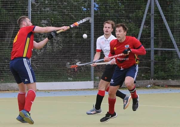 Action from City of Peterborough (red) v Bowden. Photo: David Lowndes.