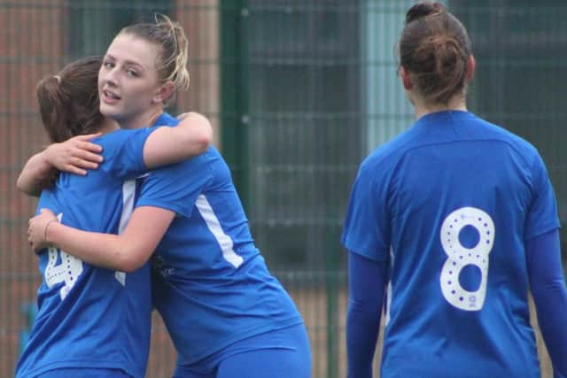 Posh goalscorers Hannah Pendred (left) and Keir Perkins celebrate.