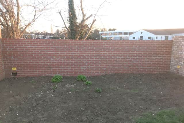 The wall which has been ordered to be torn down
