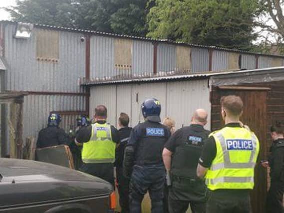 Police carrying out a raid on one of the factories. Photo: Cambridgeshire police