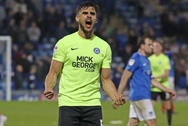 Posh centre-back Ryan Tafazolli celebrates victory at Portsmouth. Photo: Joe Dent/theposh.com.