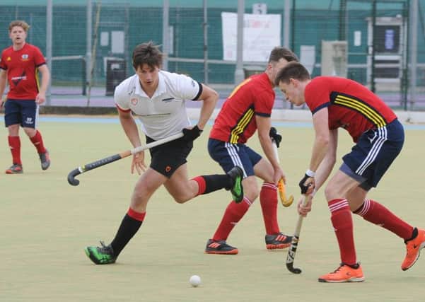 Action from the English Hockey Cup semi-final between City of Peterborough (red) and Bowden. Photo: David Lowndes.