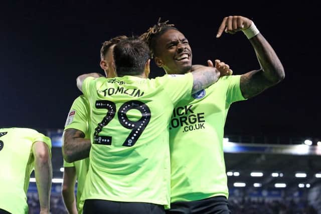 Posh stars Ivan Toney (right) and Lee Tomlin celebrate together at Portsmouth. Photo: Joe Dent/theposh.com.