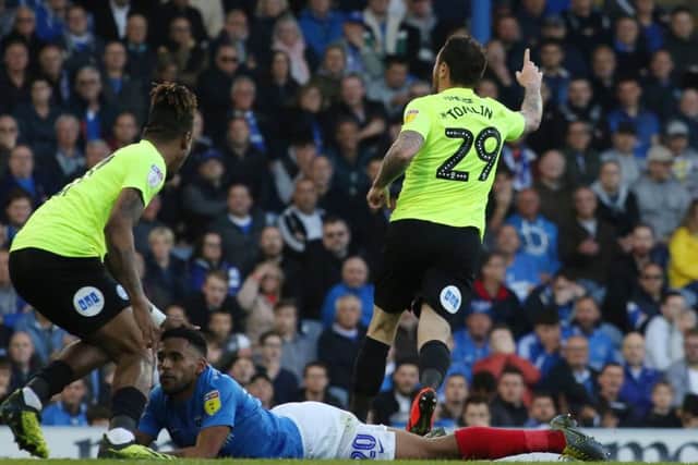 Lee Tomlin celebrates his goal for Posh at Portsmouth. Photo: Joe Dent/theposh.com.