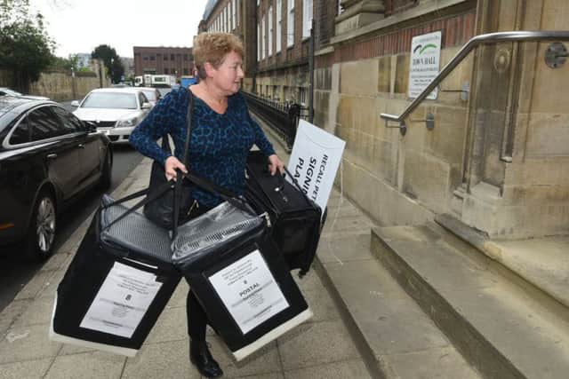 Signing forms being brought into the Town Hall on the final day of the Recall Petition