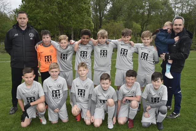 Werrington Athletic U11 before their cup final defeat. They are Stevie Winterton, Alfie Moses, Ollie Samler, Jenya Cook, Jake Boyes, Tyler Downing, Ashton Addinall, Billy Foulger, Freddy Parker, Teddy Nottle, James Mason, Alfie Wright, James Downing and Stuart Addinall with Reggie.