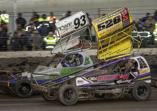 Finn Sargent dives up the inside of Sam Makin to take the lead in the White & Yellow race at Kings Lynn. Picture: Major Gilbert