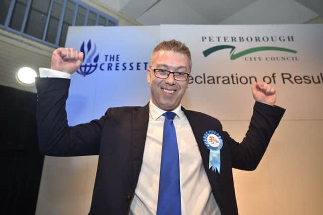 John Howard celebrates