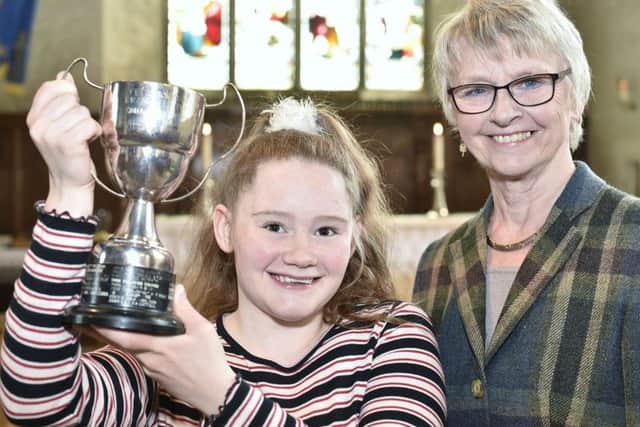 Drama Festival overall winner Daisy Reeves-Turner with her trophy presented by Festival Chairman   Pam Tedcastle. EMN-190605-094304009
