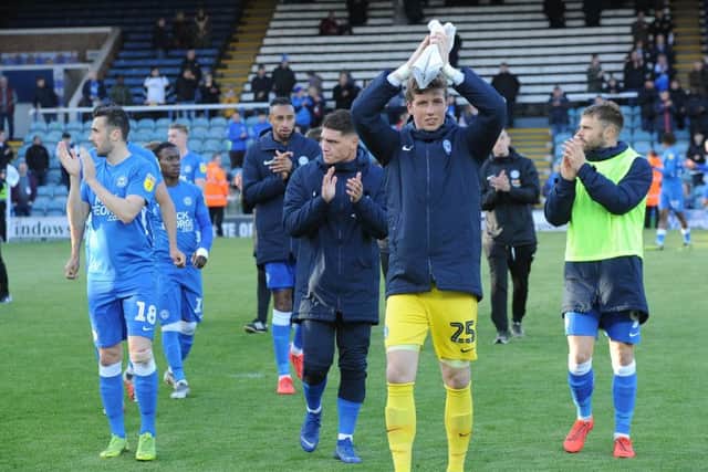 Posh players applaud the fans at the end of the win over Burton. Photo: David Lowndes.
