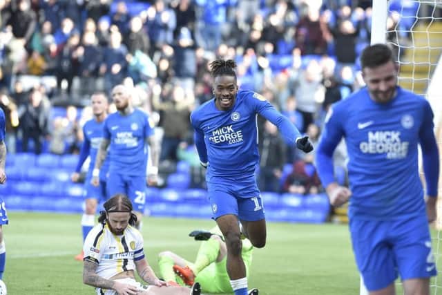 Ivan Toney is set to celebrate with Jason Naismith (foreground) after the second Posh goal. Photo: David Lowndes.