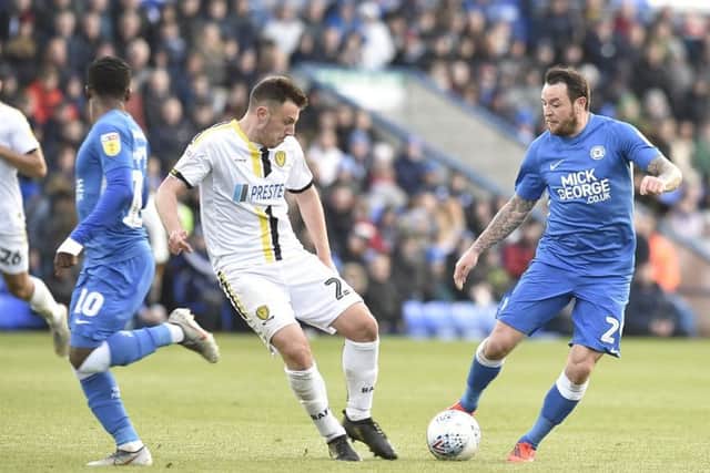 Lee Tomlin in action for Posh against Burton. Photo: David Lowndes.
