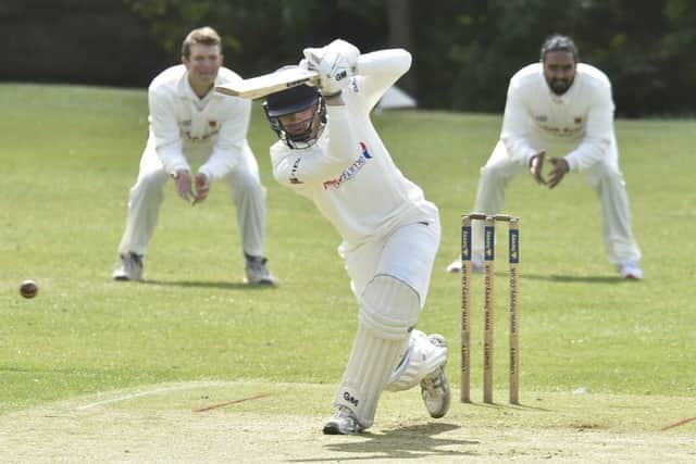 Josh Smith hits out during an innings of 63 for Peterborough Town at Oundle. Photo: David Lowndes.