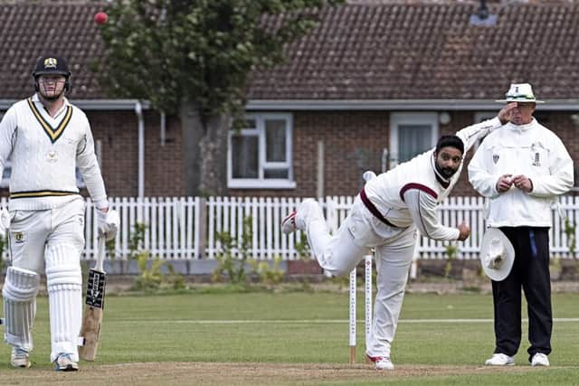 Shardul Brahmbhatt bowling for March against Eaton Socon. Photo: Pat Ringham.