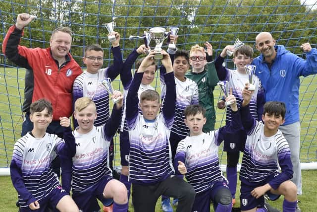 Feeder FC Under 12s celebrate their Hereward Cup success.