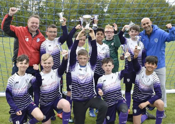 Feeder FC Under 12s celebrate their Hereward Cup success.