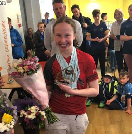Jessica OHerlihy wins the 13yrs top girl trophy.