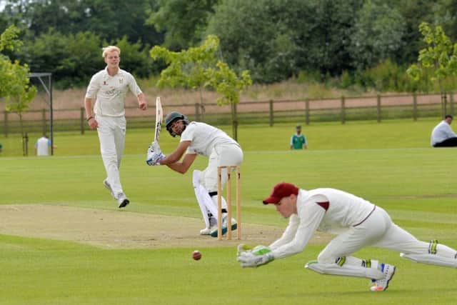 Zac Chappell in bowling action.