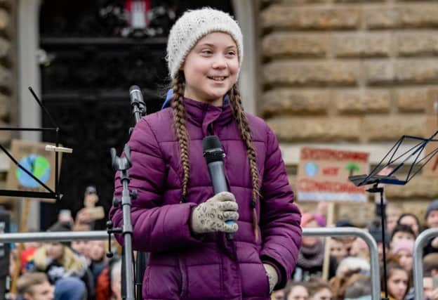 Swedish climate activist Greta Thunberg speaks on stage during a demonstration of students calling for climate protection on March 1, 2019 in front of the cityhall in Hambourg, Germany. Photo credit: AXEL HEIMKEN/AFP/Getty Images PPP-190319-103724006