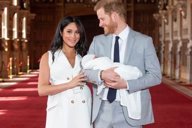 Prince Harry, Duke of Sussex, and his wife Meghan, Duchess of Sussex, with their newborn baby son Archie in St George's Hall at Windsor Castle (Photo: DOMINIC LIPINSKI/AFP/Getty Images)