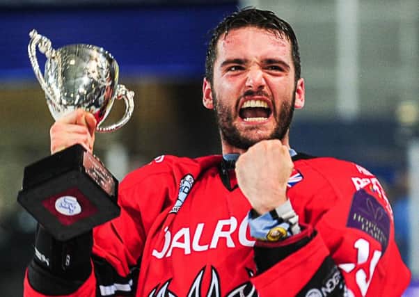 Luke Ferrara celebrates with a play-off trophy won by Peterborough Phantoms in 2015.