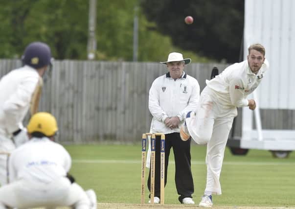 Rob Sayer bowling for Peterborough Town against Horton House. Photo: David Lowndes.