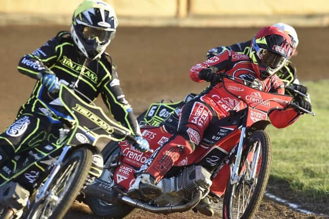 Hans Anderson (red) of Panthers racing in heat one against Ipswich. Photo: David Lowndes.