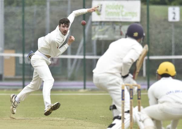 Josh Smith bowling for Peterborough Town against Horton House.