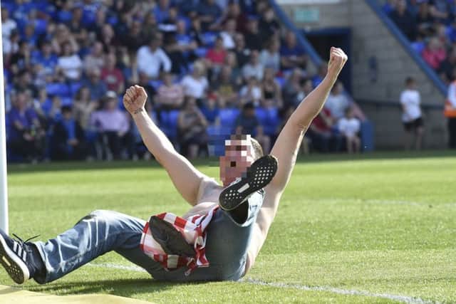 Pitch invaders at the Peterborough United v Sunderland match