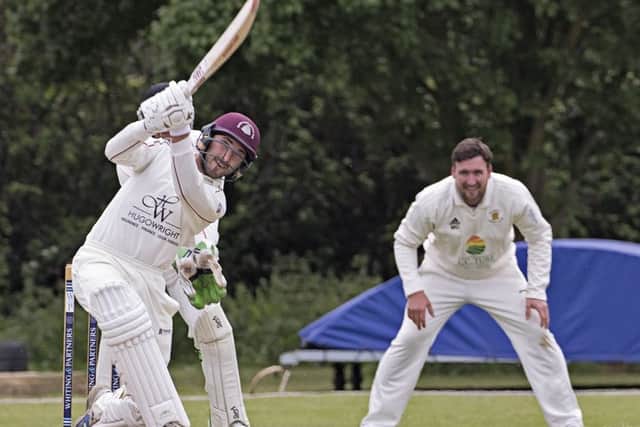 Brandon Phillips hits out during his innings of 33 for March against Ramsey. Photo: Pat Ringham.