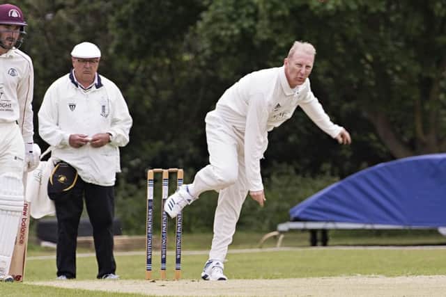 David Carlaw bowling for Ramsey against March. Photo: Pat Ringham.