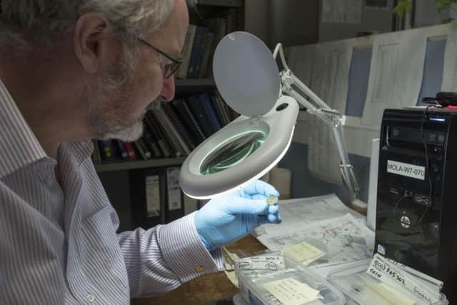 Dr Julian Bowsher examines the rare coin