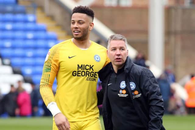 Posh goalkeeper Aaron Chapman with manager Darren Ferguson.