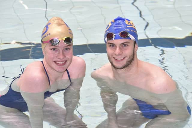 Olivia Lee and Matt Gray training with COPS swimmers at the Regional Pool. EMN-190520-222723009