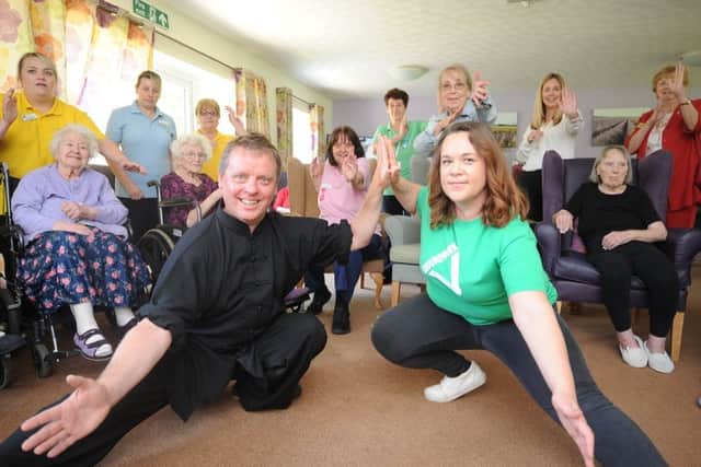 Tai-Chi coach Ray Pawlett with sponsor Katie Dean with staff and residents at the launch of a Action for Elders scheme at Werrington Lodge care home, Baron Court EMN-190524-144741009
